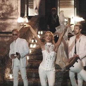  The image shows the group “Miguel Team Group,” consisting of four boys and one girl. They are all dressed in white.