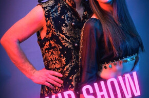 The image shows the artists Moris and Jenny.