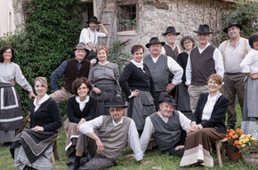 image of a group of men and women wearing traditional clothes from the past