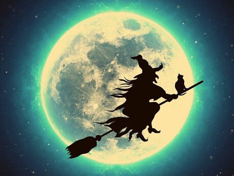 The image shows a hag on a broomstick and a full moon in the background