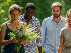 The photo shows a group of people dressed in light casual clothes who are taking a NatureTherapy walk immersed in nature. The guide is holding a bunch of lavender in his hands. Their faces convey serenity