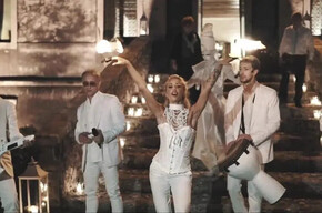  The image shows the group “Miguel Team Group,” consisting of four boys and one girl. They are all dressed in white.