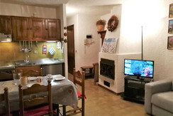 soggiorno con angolo cottura