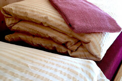 Rifugio Alimonta - Bett mit Bettwäsche